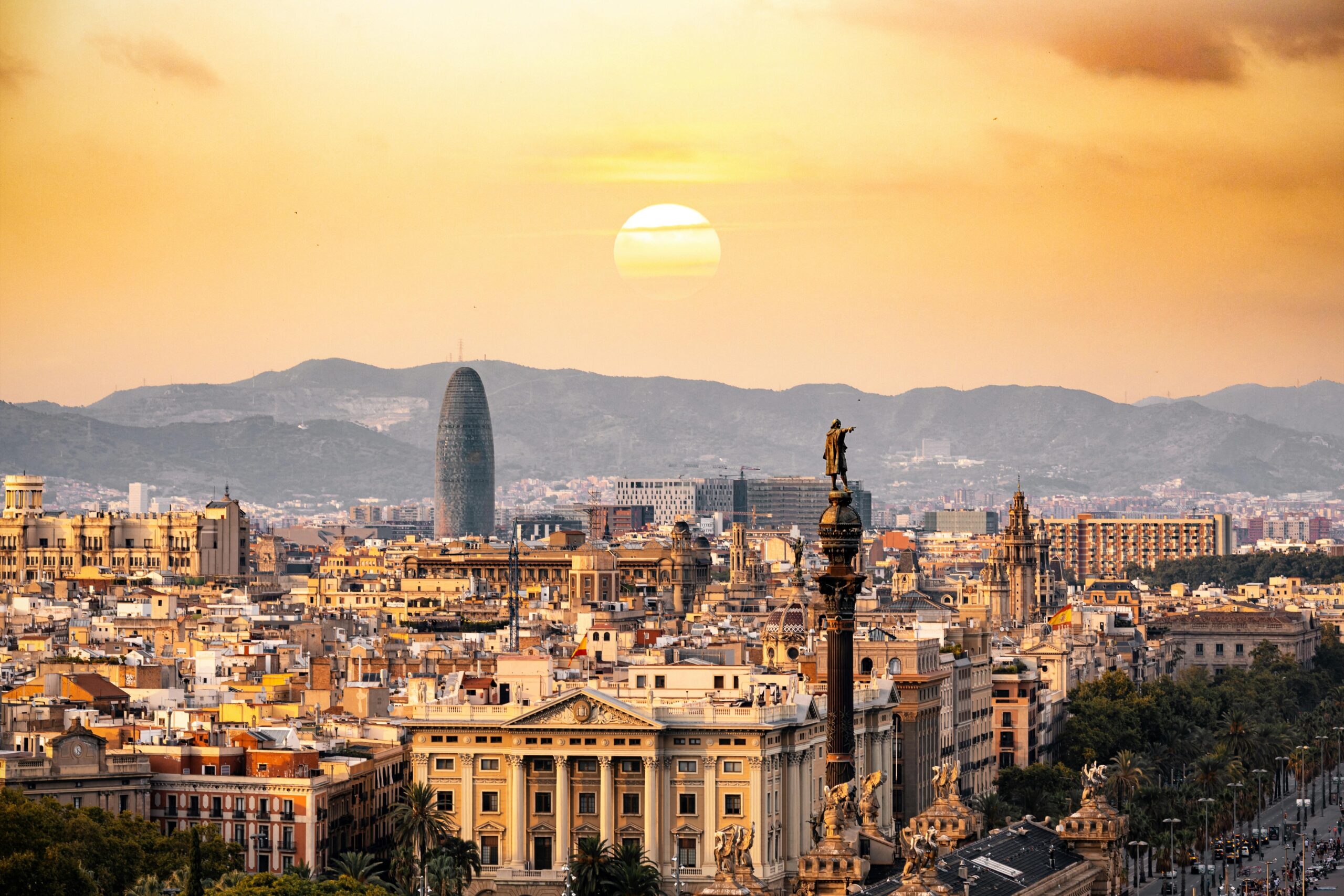 A picturesque view of Sagrada Familia with surrounding trees in Barcelona, Spain.